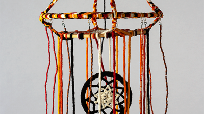 Finding Balance Together Judy Phillips, “Finding Balance Together”, Yarn, wooden and metal hoops, beads, and wire, 3D art about 15-inch diameter and 24 inches tall