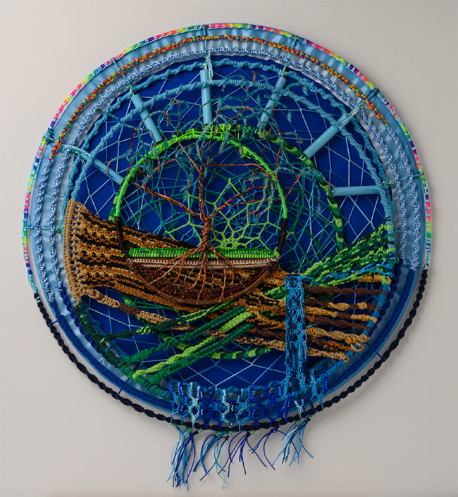 Nature’s Harmony, by Judy Phillips, Various cording, craft metal, beading on metal hoops, 24 inch diameter circle