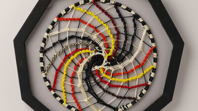 More than Black and White More than Black and White, by Judy Phillips, macrame cording on metal hoop, 18 inch diameter in frame