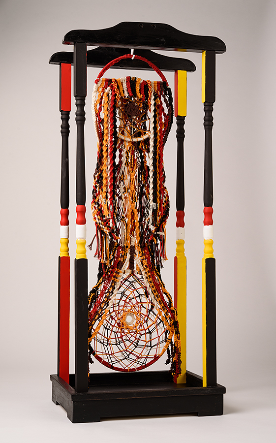Threads of Humanity, by Judy Phillips, macrame cording on metal hoop, approximately 12 x 12 x 24 inches