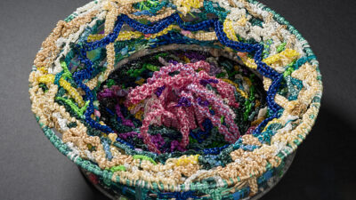 Under Pressure “Under Pressure by Judy Phillips from “One Shared Earth,” Fiber art sculpture, mixed media, 12 inch diameter by 5 inches tall