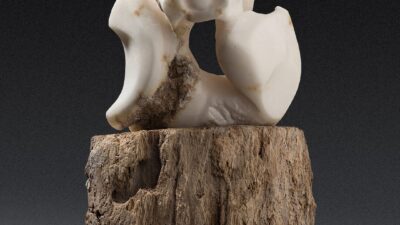 “Owl at Night” by Eleanor Mitten from “One Shared Earth,” Alabaster, wood, 10 inches tall x 10 inches long