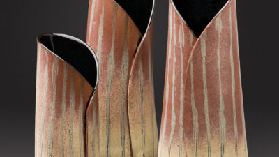 “Kaitiaki” by Katherine M Greig, Slab built stoneware clay, underglazed, then glazed, (2) 11 inches tall, (1) 8 inches tall