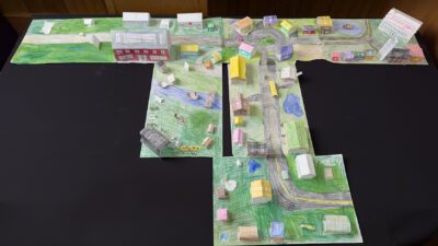 “Nobilicity” by Mina Blyth, Isaiah Sabera, Gloria Sabera, Cora Conte, James Conte, Colored pencil, 3d paper collage, 39 x 68 inches